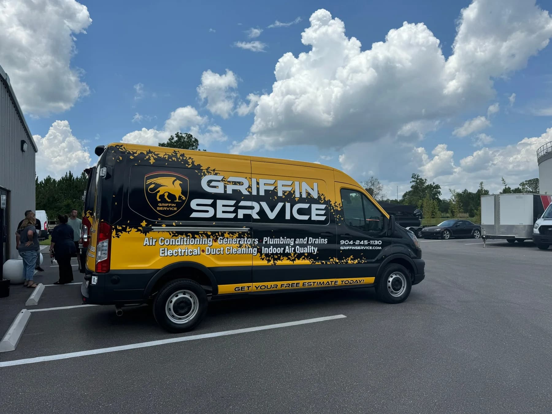 Griffin Service black and yellow wrapped commercial service van parked outdoors