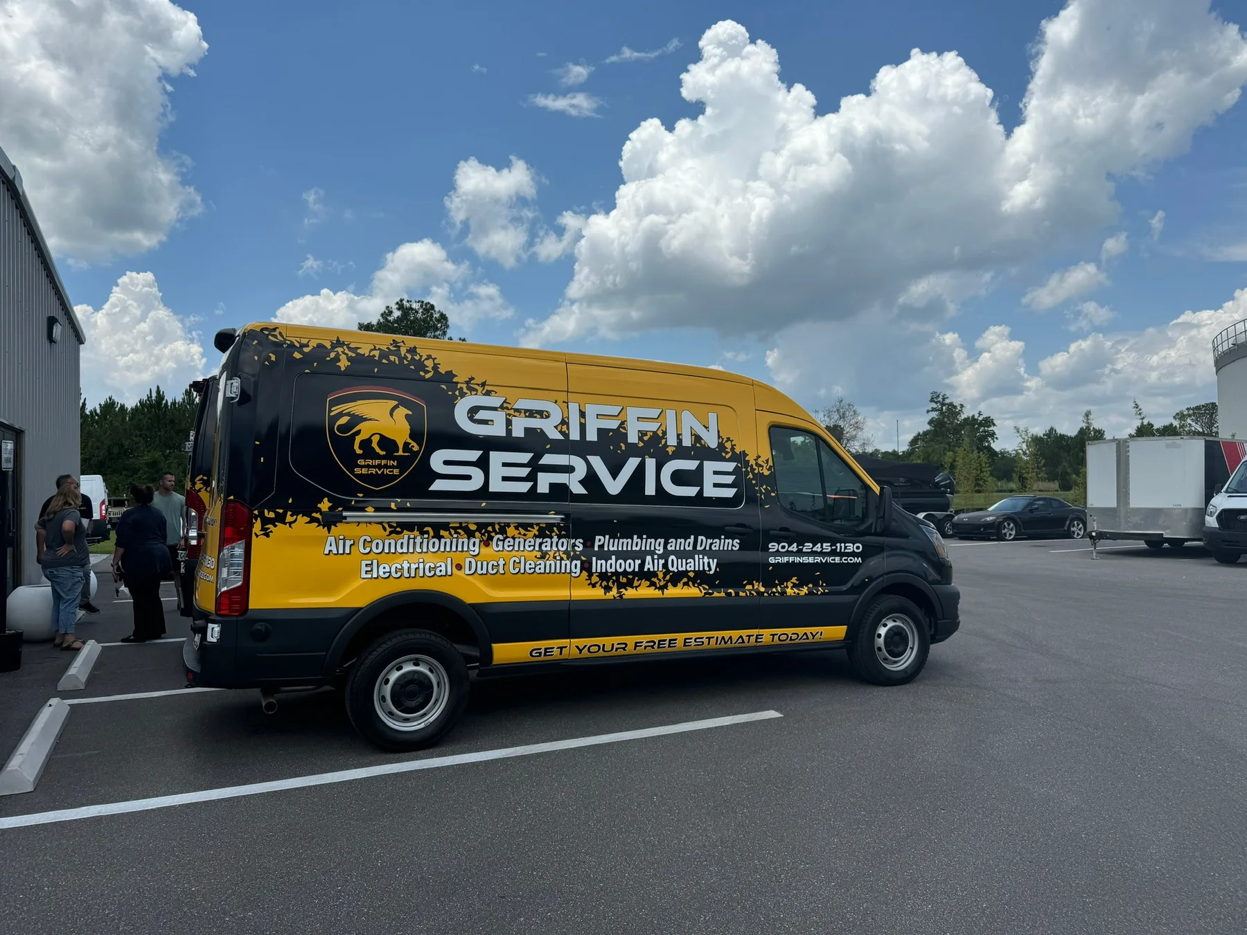 Griffin Service black and yellow wrapped commercial service van parked outdoors