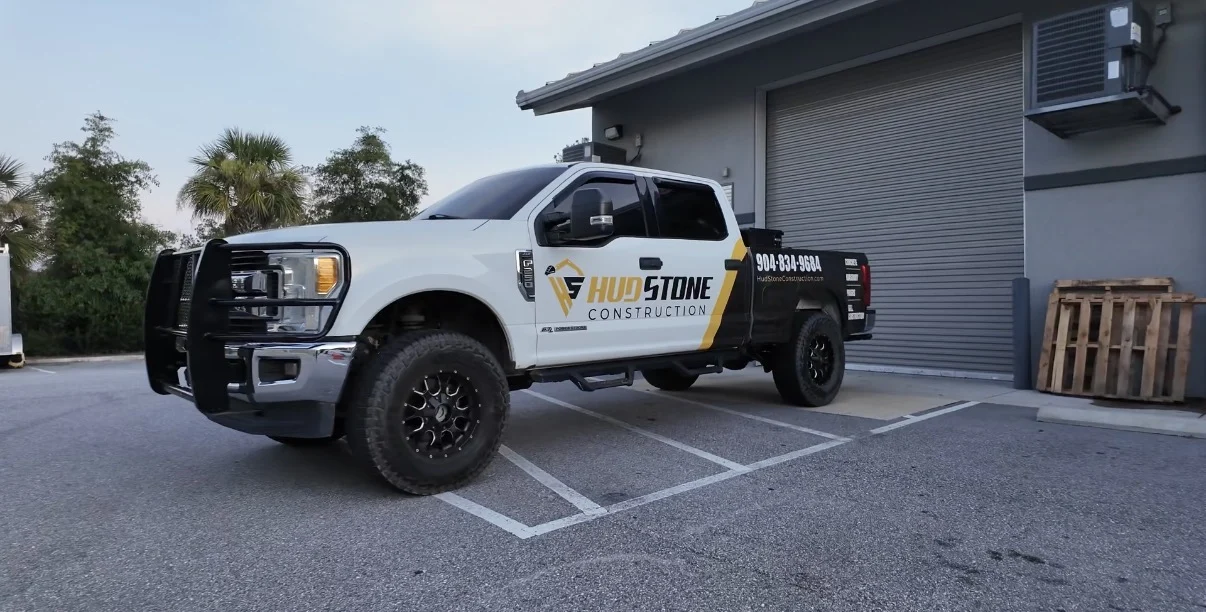 HudStone Construction white, black, and gold commercial pickup graphics